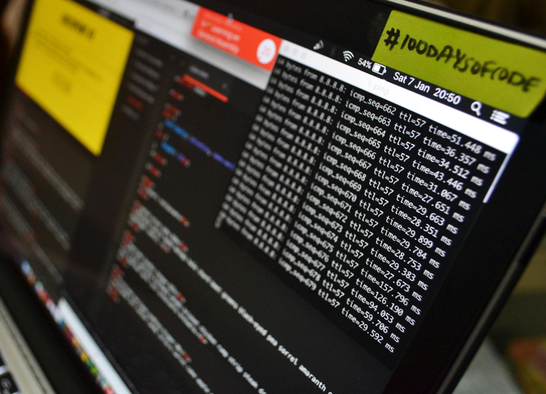 Laptop displaying coding and data analysis in progress